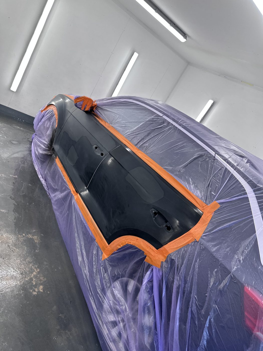 Bumper masked and prepped for respray in the paint booth