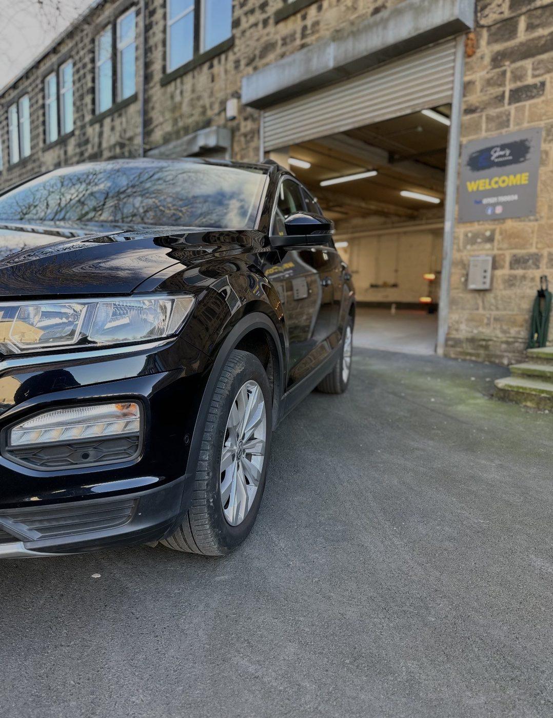 Customer's car outside Shaw's Bodyshop workshop entrance in Guiseley